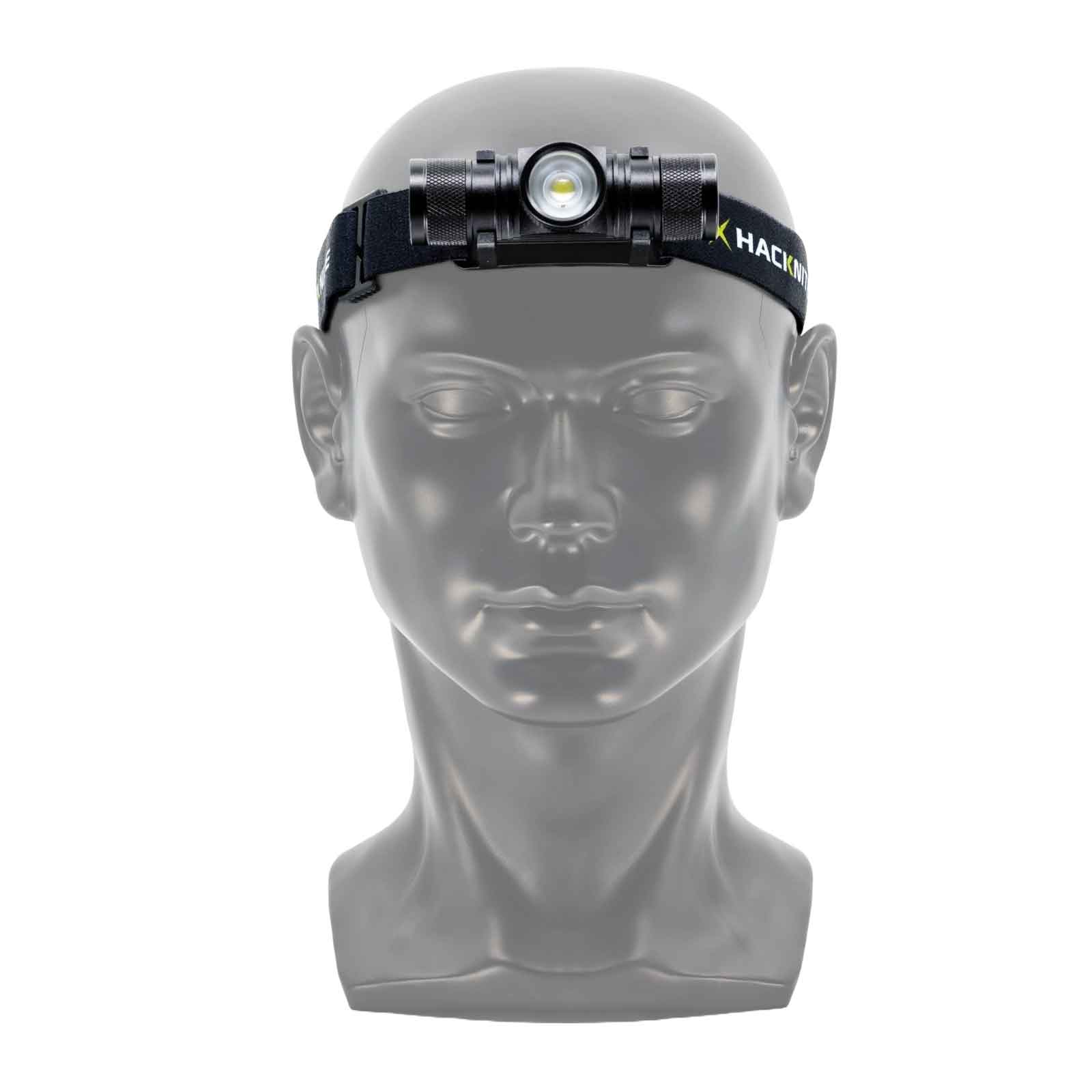 Vue de face de la lampe frontale Photoris 500, avec 500 lumens, portée sur une tête en plastique